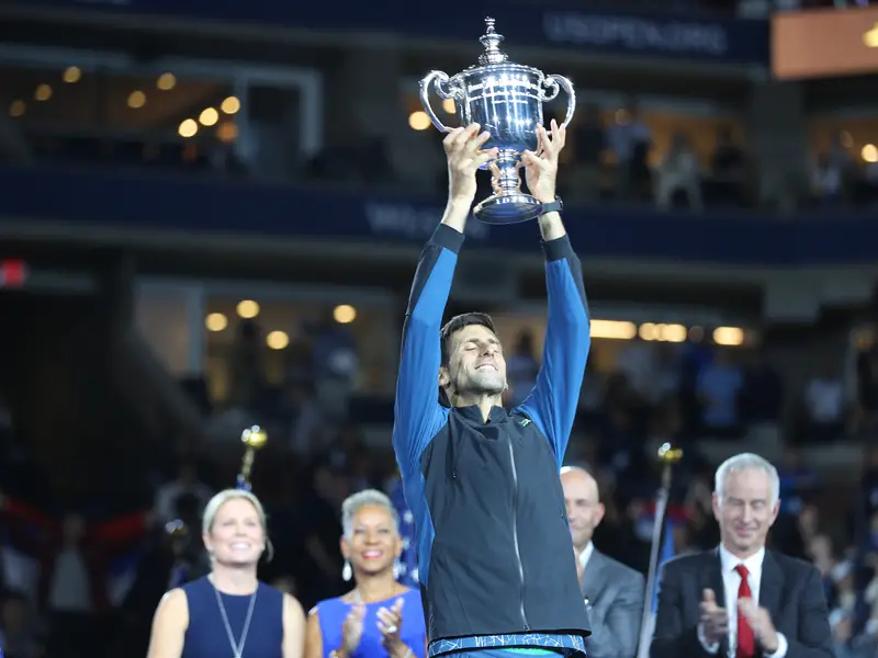 2018 US Open champion Novak Djokovic of Serbia posing with US Open trophy during trophy presentation after his final match victory